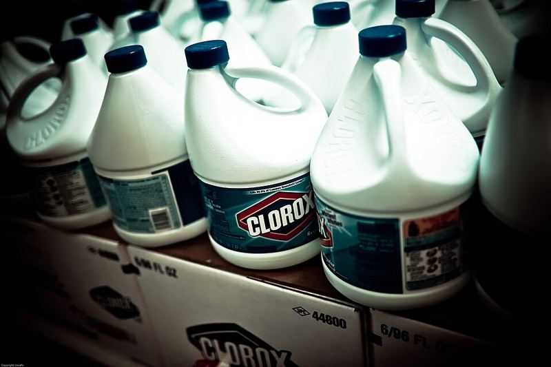 Rows of white jugs of plain household bleach